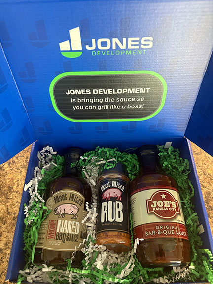 Jones Development Open BBQ Box, containing three bottles of BBQ Sauce and filler confetti